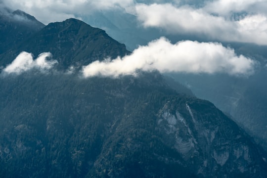 clouds near grass covered mountain in Kramerspitz Germany