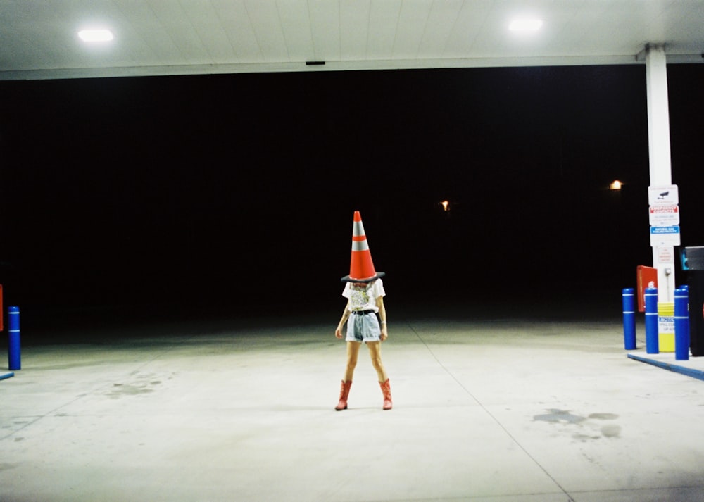 person wearing street cone