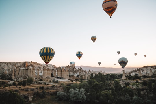multicolored hot air balloons above mountain during daytime in Cappadocia Turkey Turkey