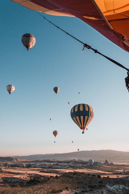 multicolored hot balloons above mountain during daytime in Göreme Turkey