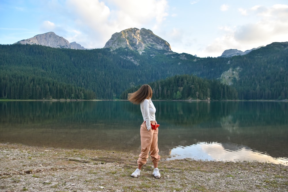 woman wears white long-sleeved shirt