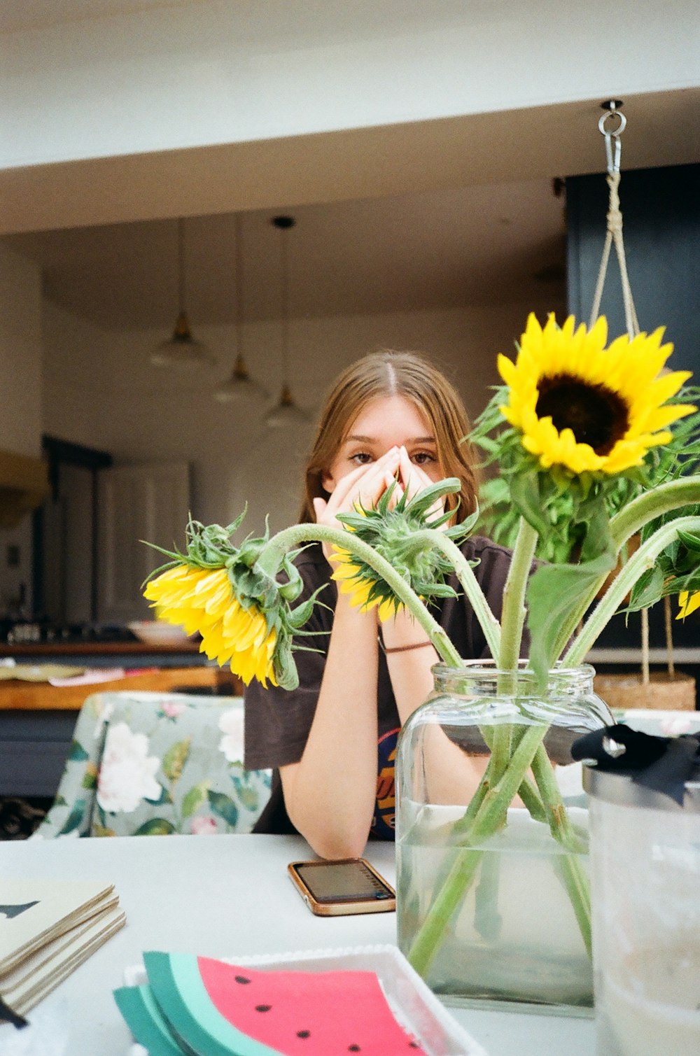 yellow sunflowers beside girl
