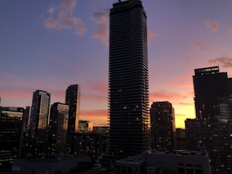 Sunset view of Trilive’s towering 45-story skyline glowing warmly against the evening sky.