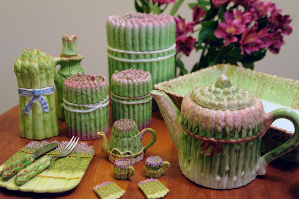 green tea set on brown wooden surface