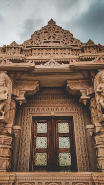 The temple’s beautifully carved wooden doors showcasing intricate craftsmanship