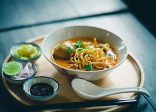 ramen on brown tray