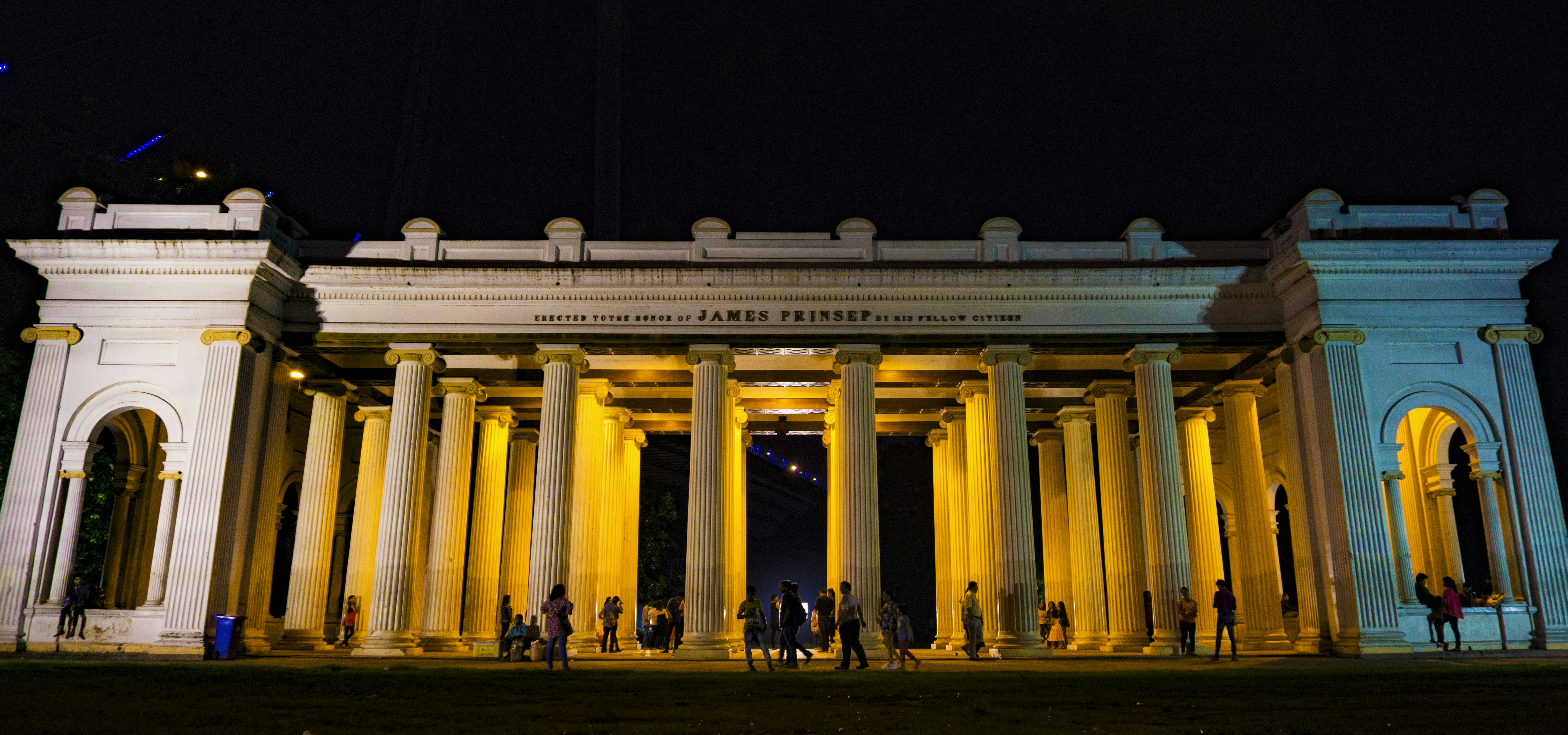 white concrete building with column, Prinsep Ghat, Kolkata. The Palladian porch in the memory of the eminent Anglo-Indian scholar and antiquary James Prinsep was designed by W. Fitzgerald and constructed in 1843.