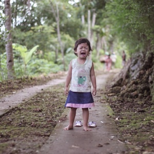 toddler girl wears white tank top