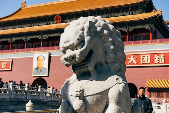 gray Fu dog statue in Tiananmen China