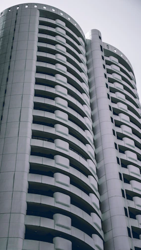 A sleek modern residential building developed by Sekara Living, showcasing clean lines and minimalist design.