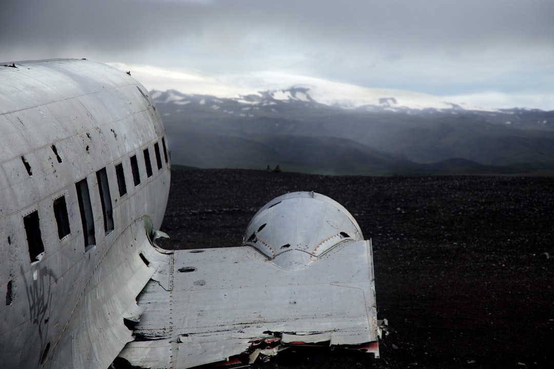 wrecked white airplane across white mountain