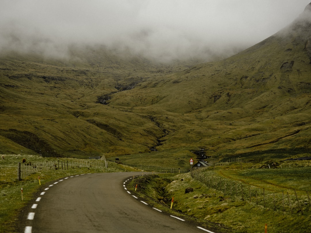 foggy mountain and asphalt spiral road
