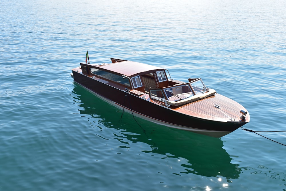 black and white boat on body of water