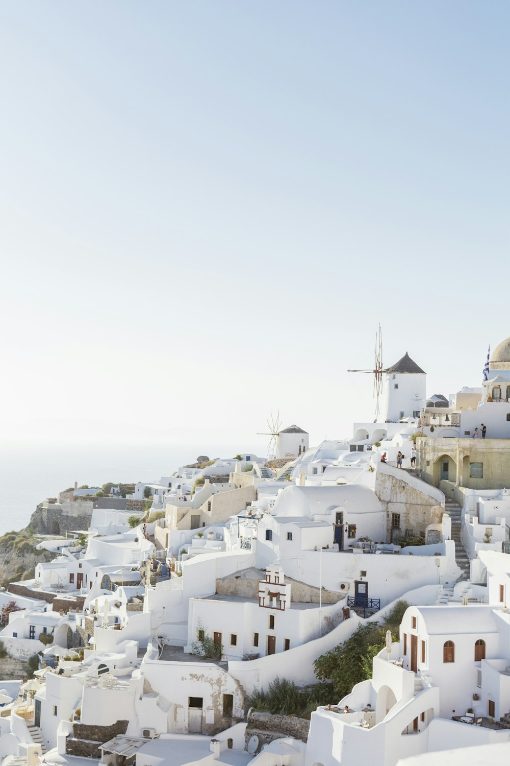 a view of a white village on a cliff