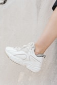 unpaired white shoe