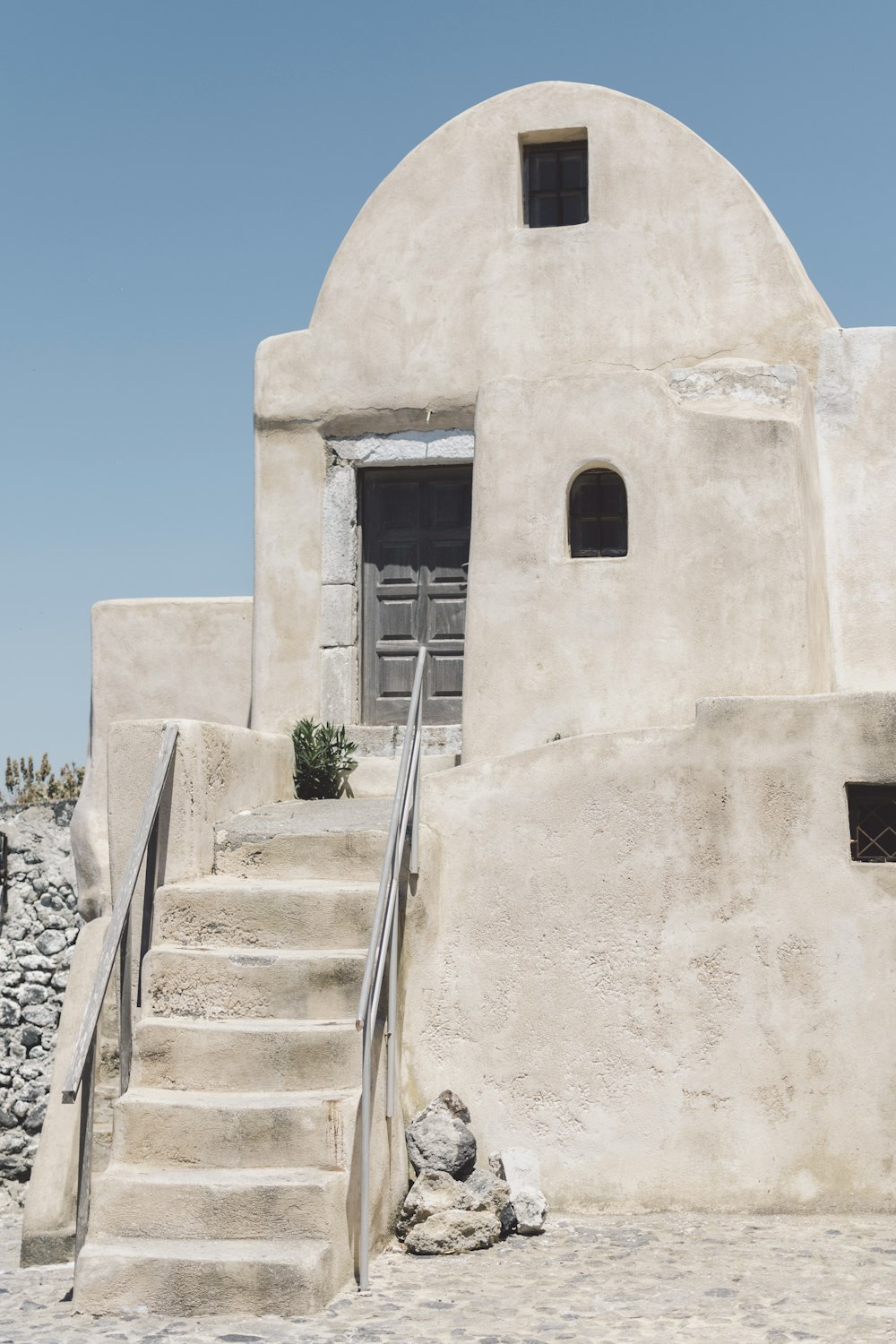 a white building with steps leading up to it