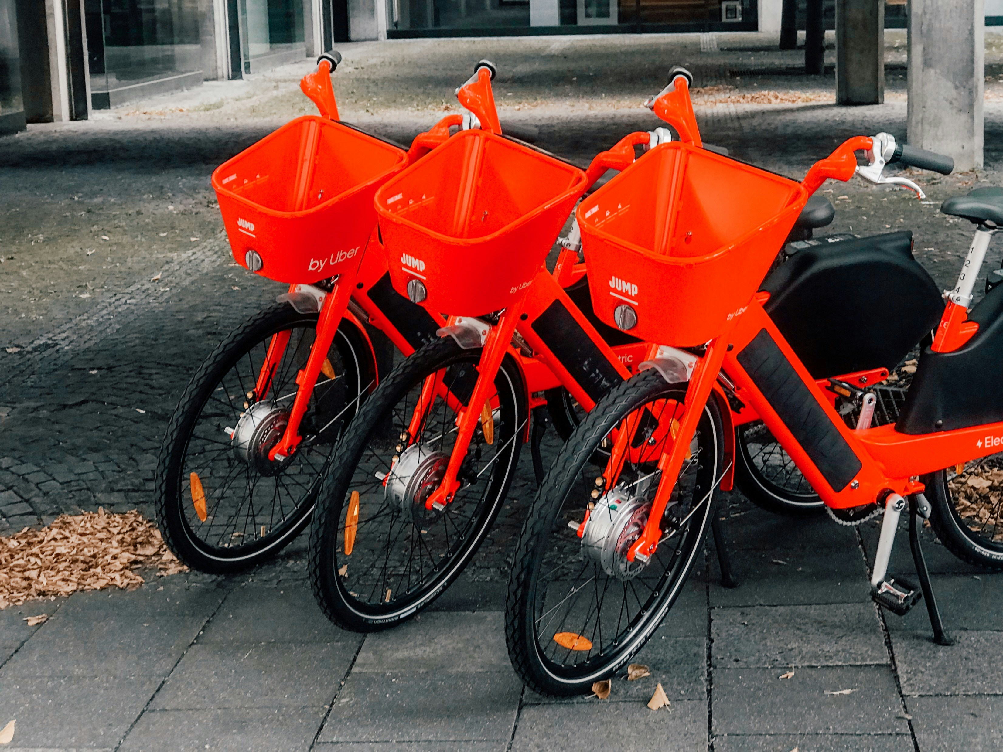 Three bicycles near post