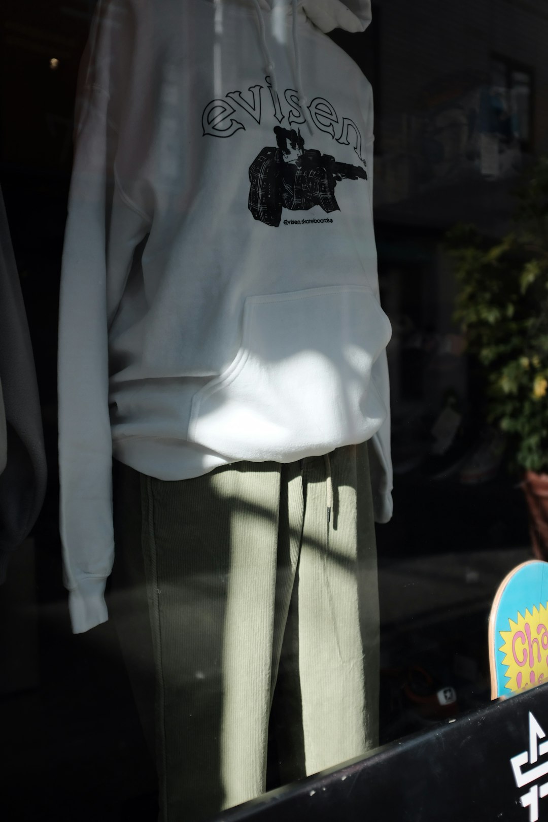 white and black Evisen hoodie on display