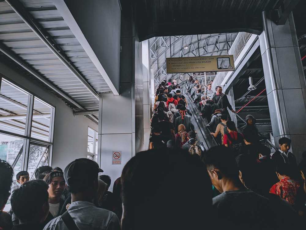 people walking up on escalator