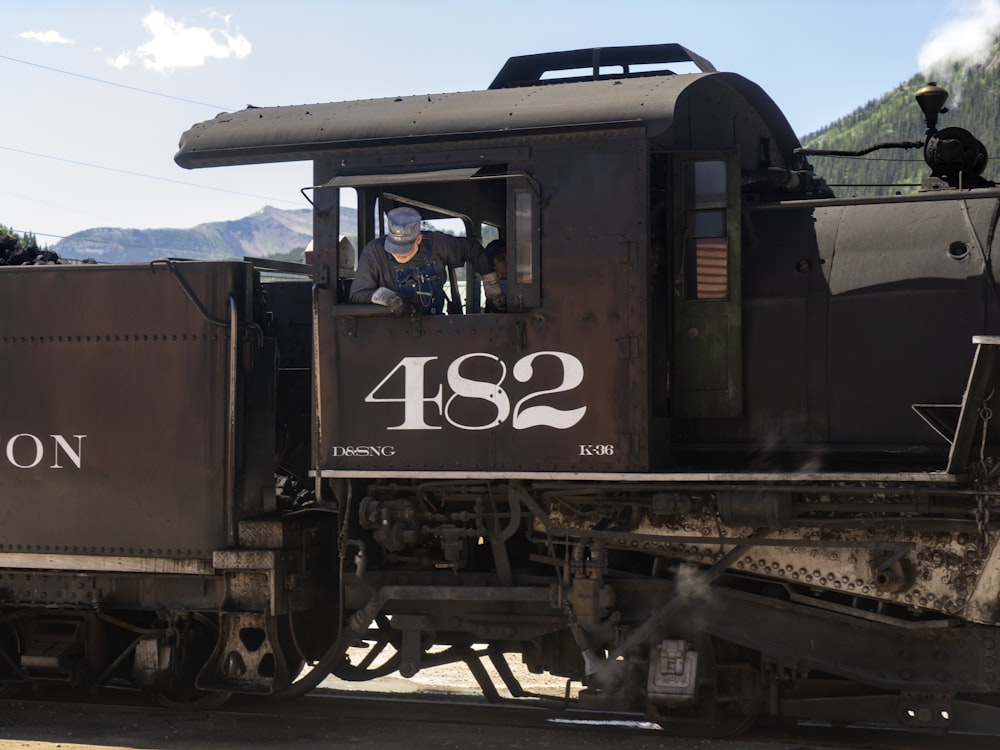 man riding train