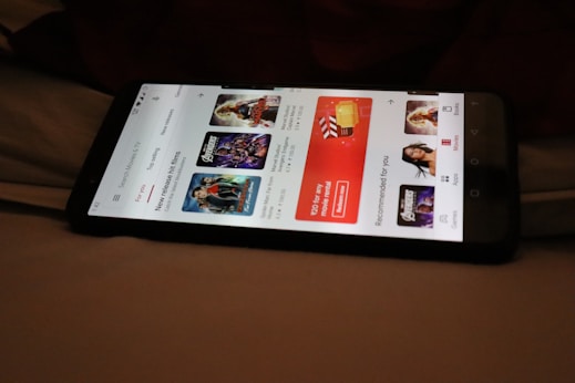 A mobile phone displaying the streamvdo app with a highlighted new release.