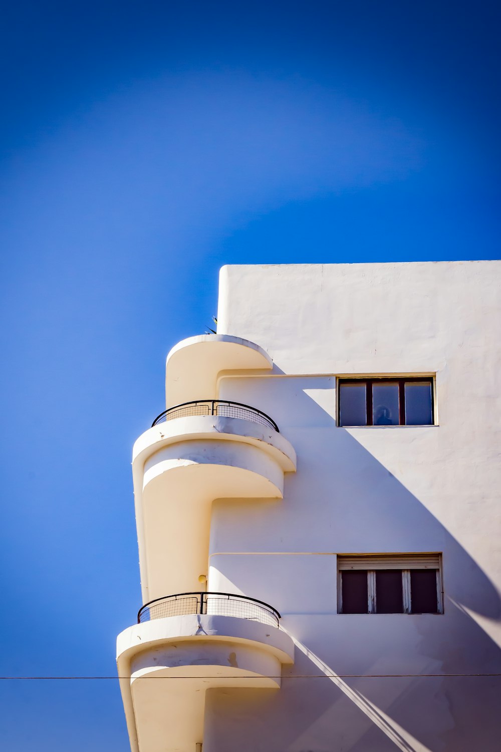 white concrete building under blue sky during daytime