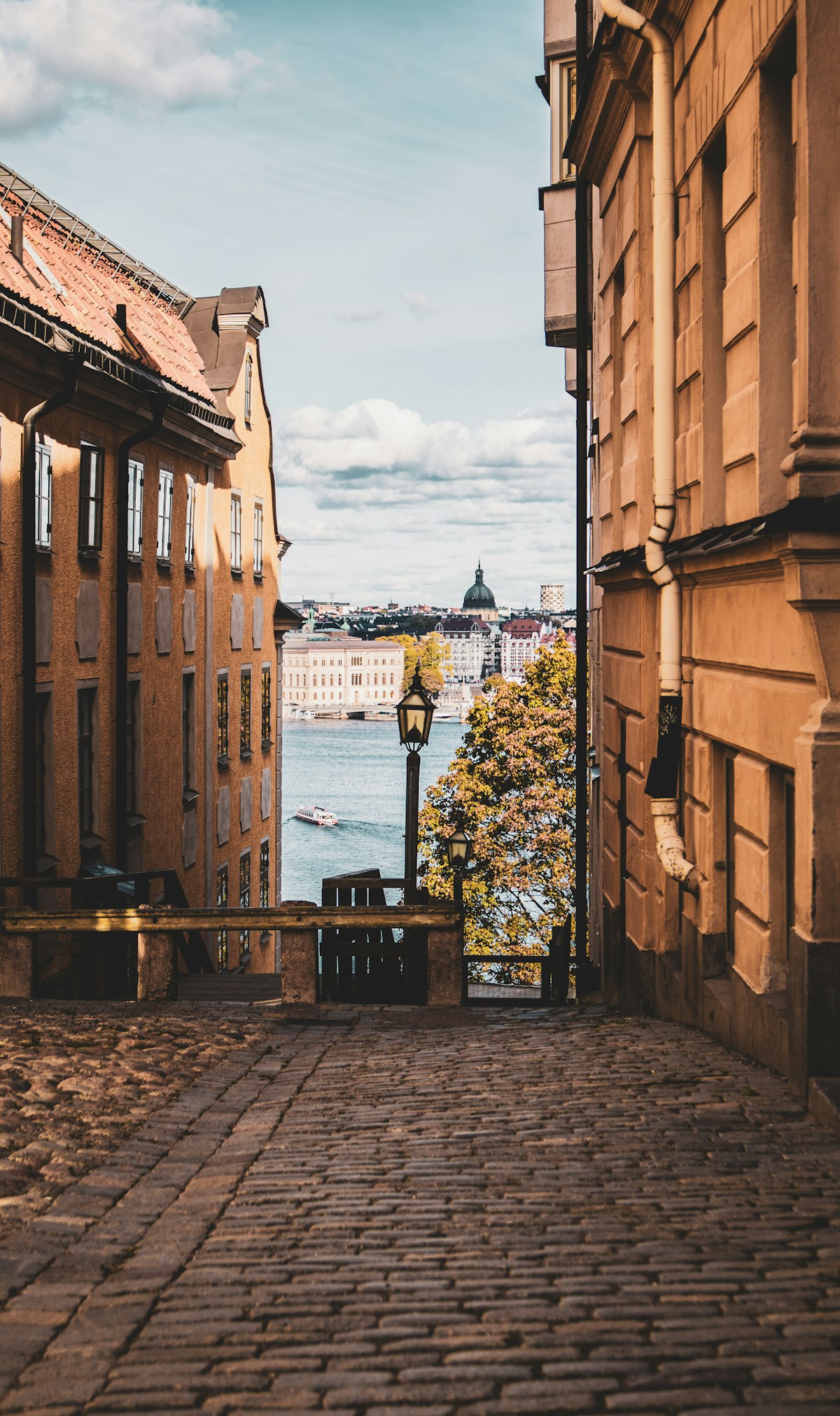 Stockholm waterfront buildings with autumn colours reflecting in the harbour