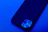 A close-up of a sleek gaming phone with vibrant blue LED accents glowing against a dark background.