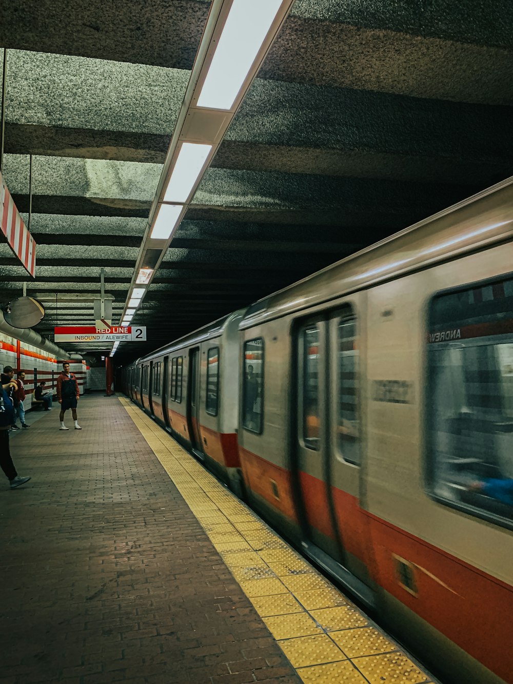 a subway train pulling into a train station