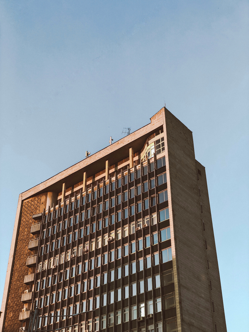 brown mid-rise building during daytime