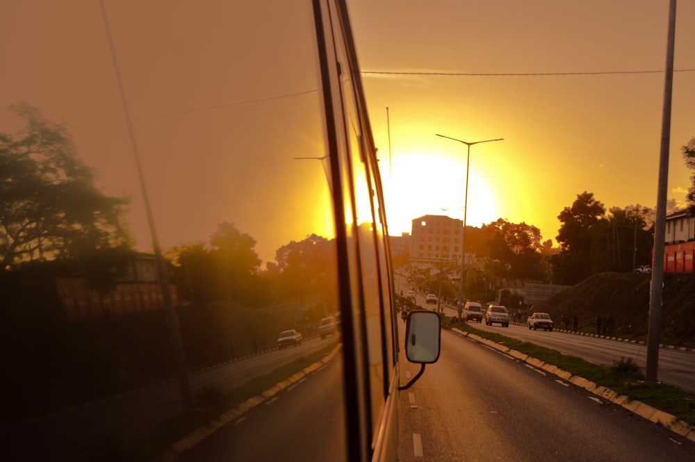 vehicle on road during golden hour