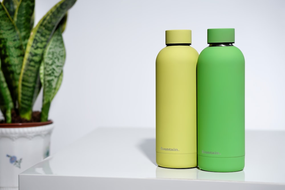 two green and yellow tumblers