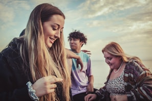 A smiling teenager enjoying time with friends outdoors