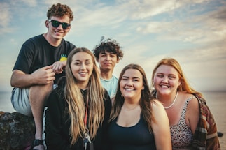 photography of five people near outdoor during daytime