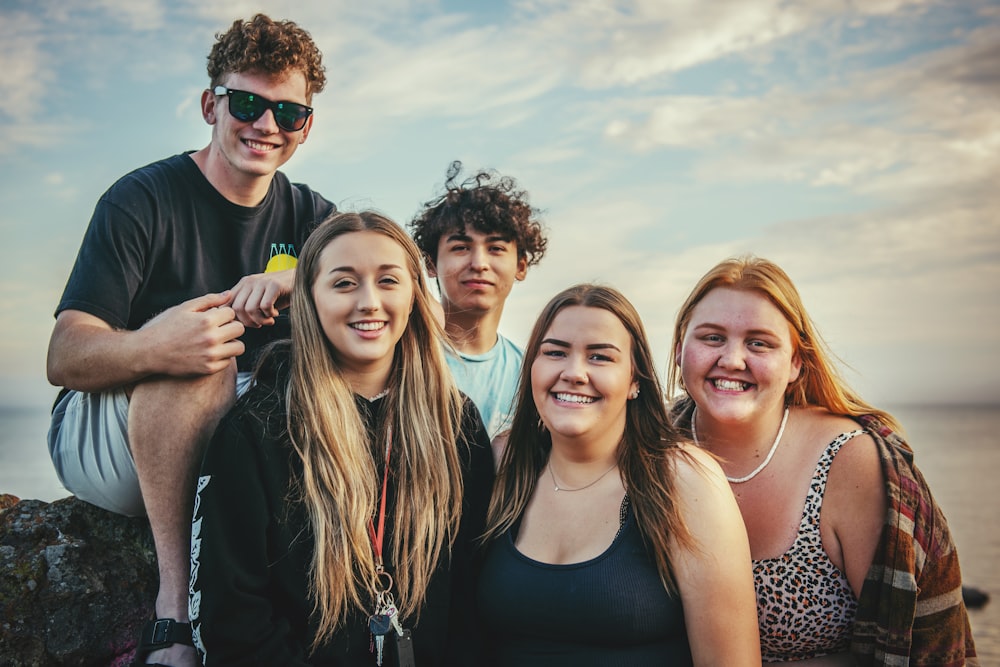 photography of five people near outdoor during daytime