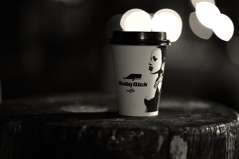 a black and white photo of a coffee cup