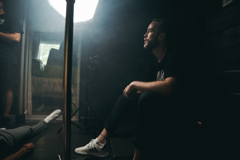 man wears black T-shirt