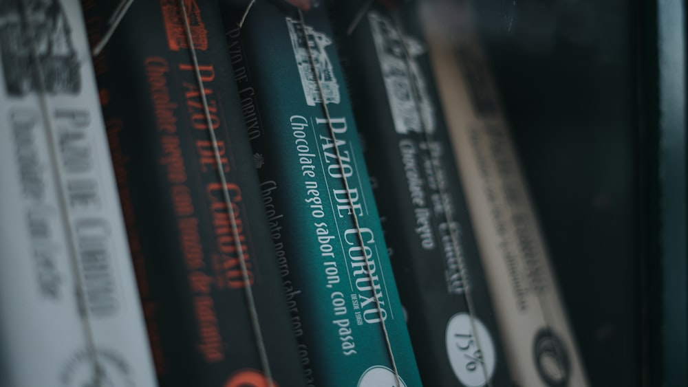 a row of books sitting on top of a shelf