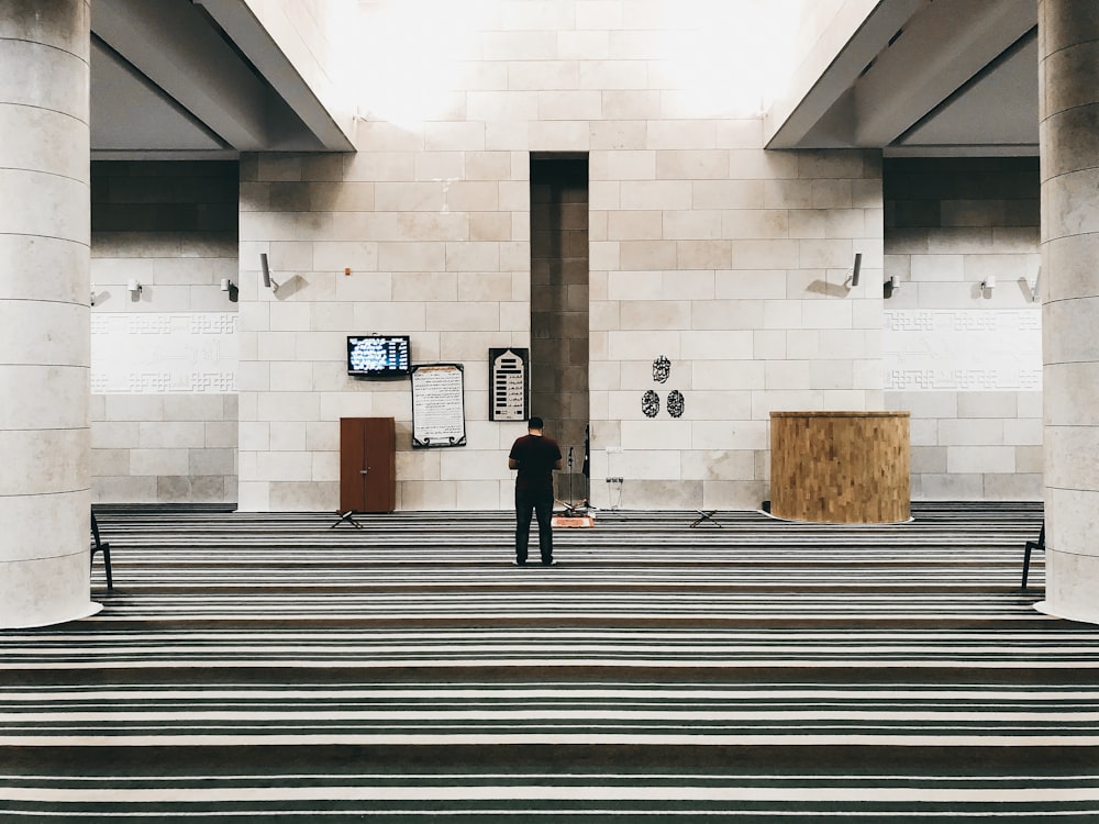 person standing near lectern