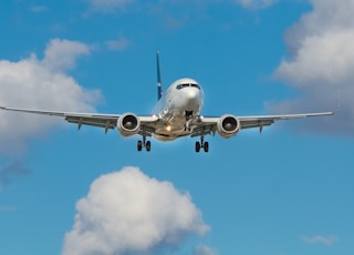 white airplane on mid air