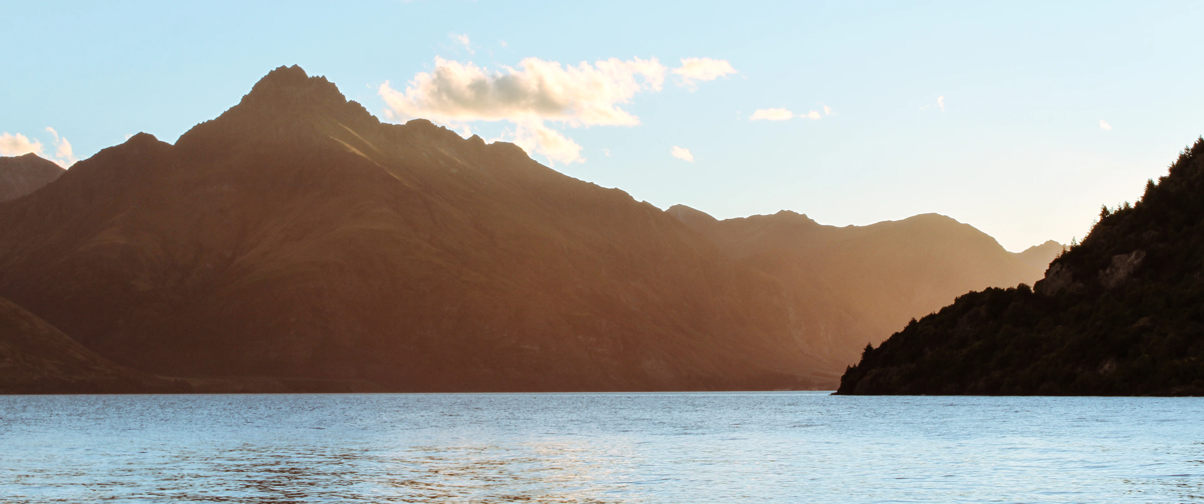 Mountains above the calm water of Lake Wakatipu near Queenstown