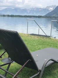 A peaceful lakeside view with lounge chairs inviting guests to unwind.