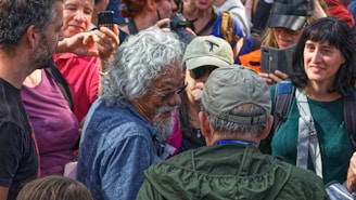 A candid shot of Elder Martins engaging with community members during a service event