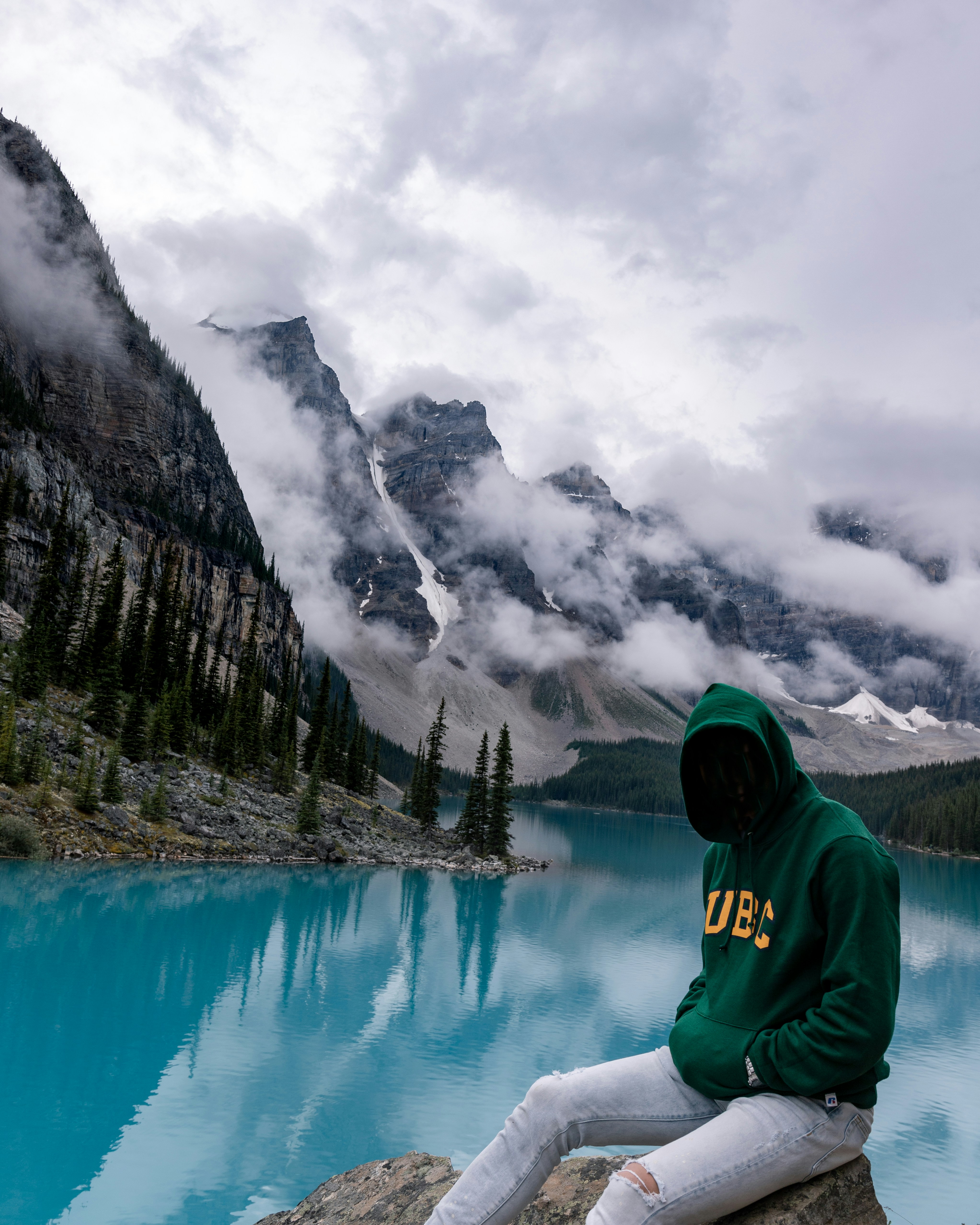 man wears black pullover hoodie