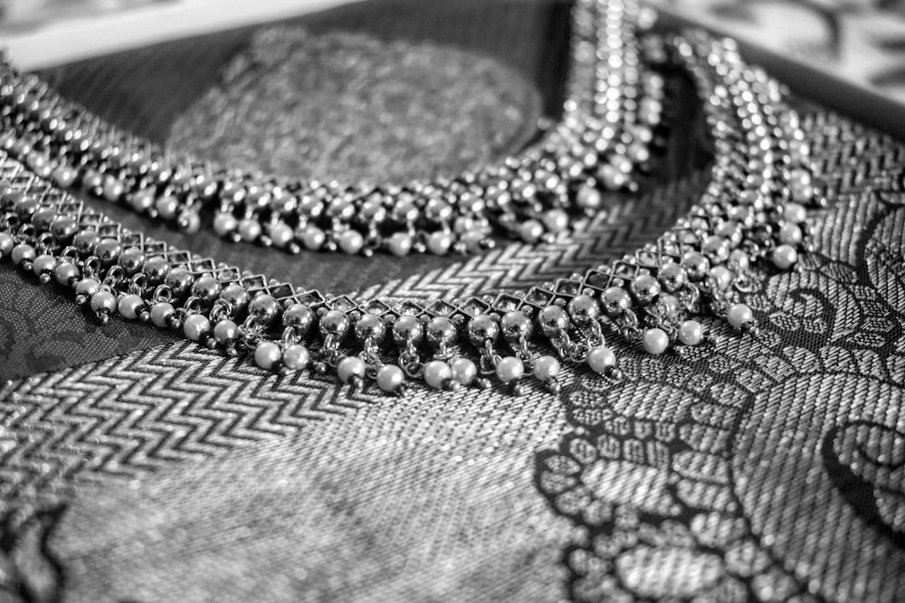 gray beaded garment