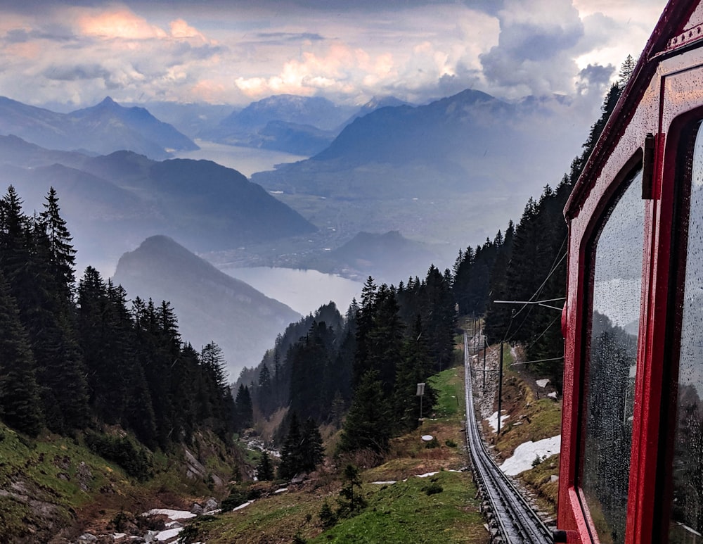 red train during daytime photo