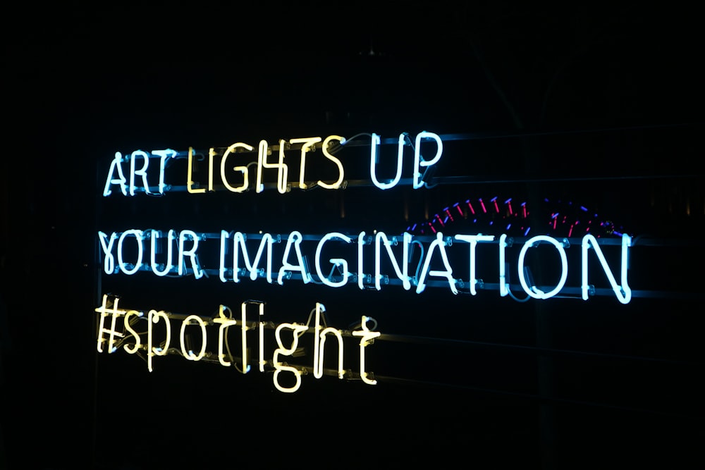 a neon sign that says art lights up your imagination spotlight