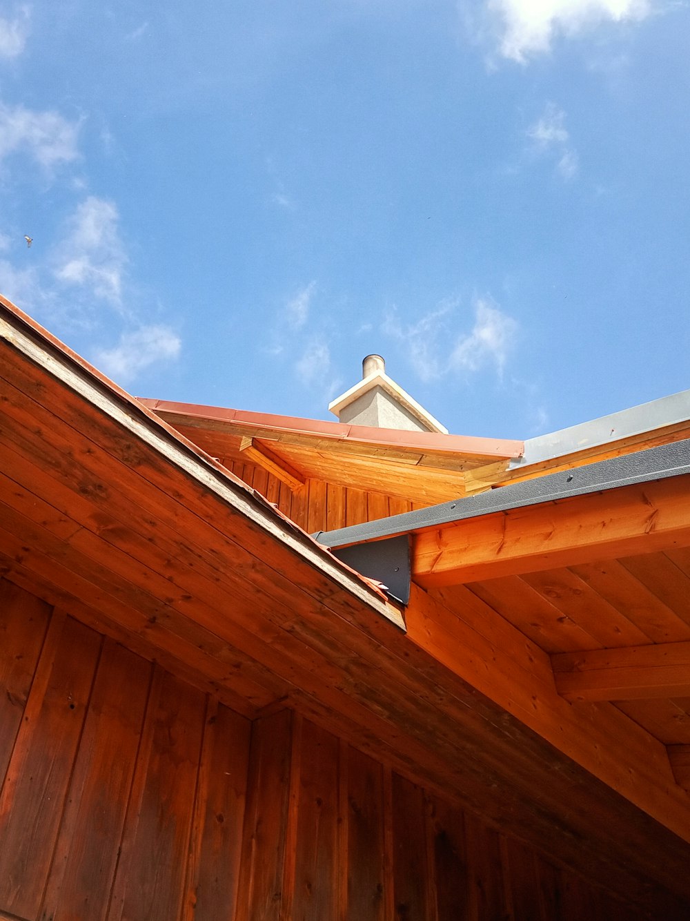 brown wooden house under blue sky during daytime