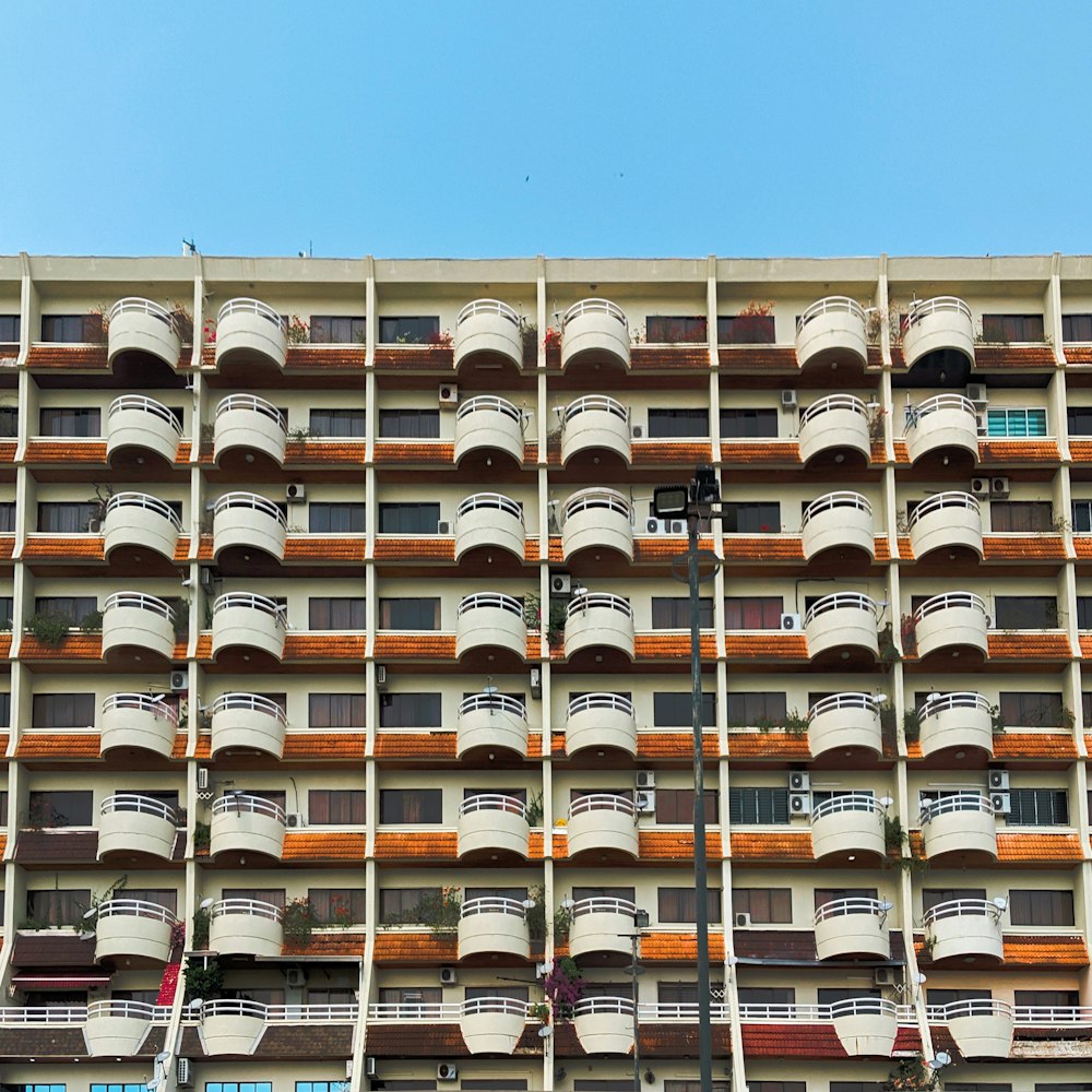 a tall building with balconies and balconies on the sides