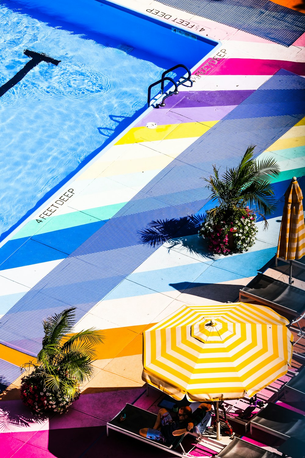 yellow and white striped patio umbrella